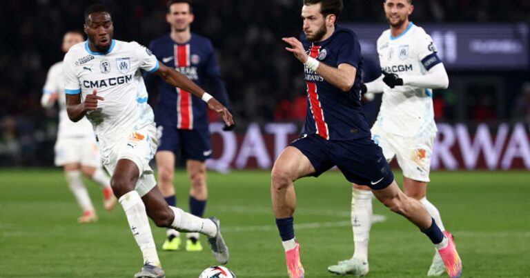 Paris Saint-Germain's Portuguese defender #25 Nuno Mendes (C) controls the ball during the UEFA Champions League first round day 1 football match between Paris Saint-Germain (FRA) and Atalanta (ITA) at the Parc des Princes stadium in Paris on September 17, 2025. (Photo by FRANCK FIFE / AFP)
