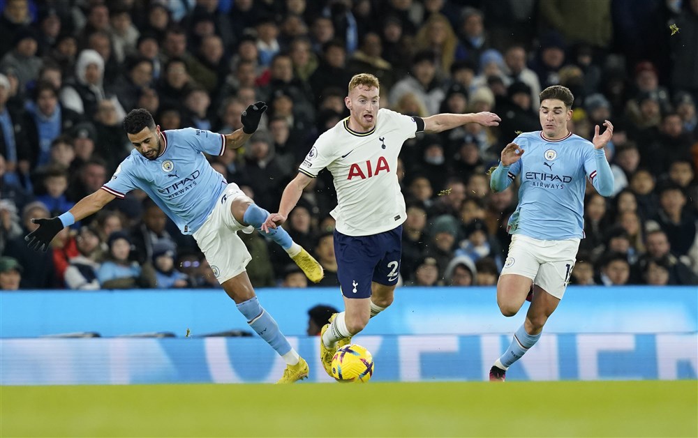 epa10416536 Dejan Kulusevski of Tottenham (C) is fouled by Riyad Mahrez of Manchester City (L) as Julian Alvarez of Machester City looks on during the English Premier League soccer match between Manchester City and Tottenham Hotspur in Manchester, Britain, 19 January 2023. EPA-EFE/Andrew Yates EDITORIAL USE ONLY. No use with unauthorized audio, video, data, fixture lists, club/league logos or 'live' services. Online in-match use limited to 120 images, no video emulation. No use in betting, games or single club/league/player publications